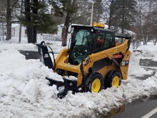 Clearing Sidewalks with New Cat 242D Skid Steer